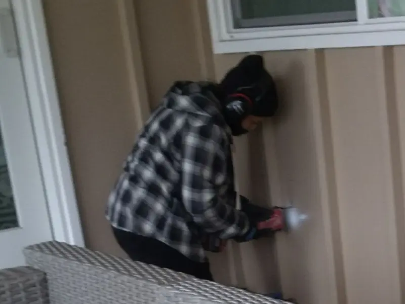 Professional electrician installing an exterior outlet in Picayune