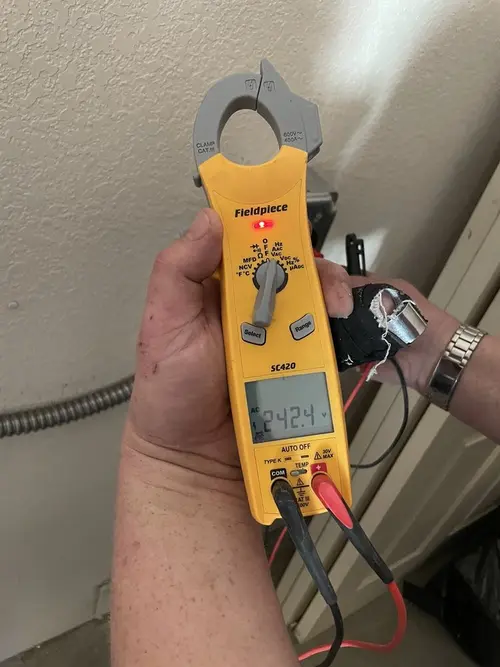 Voltage testing with clamp meter during Whole House Surge Protector in Picayune